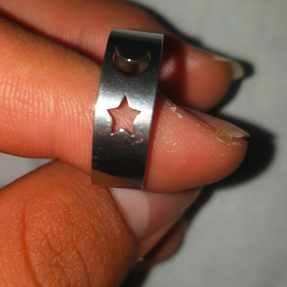 A stainless steel fashion ring with the moon 🌙 and a  star 🌟 shape on it - Picture 3 of 3